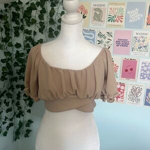 Tan blouse with semi open tied back